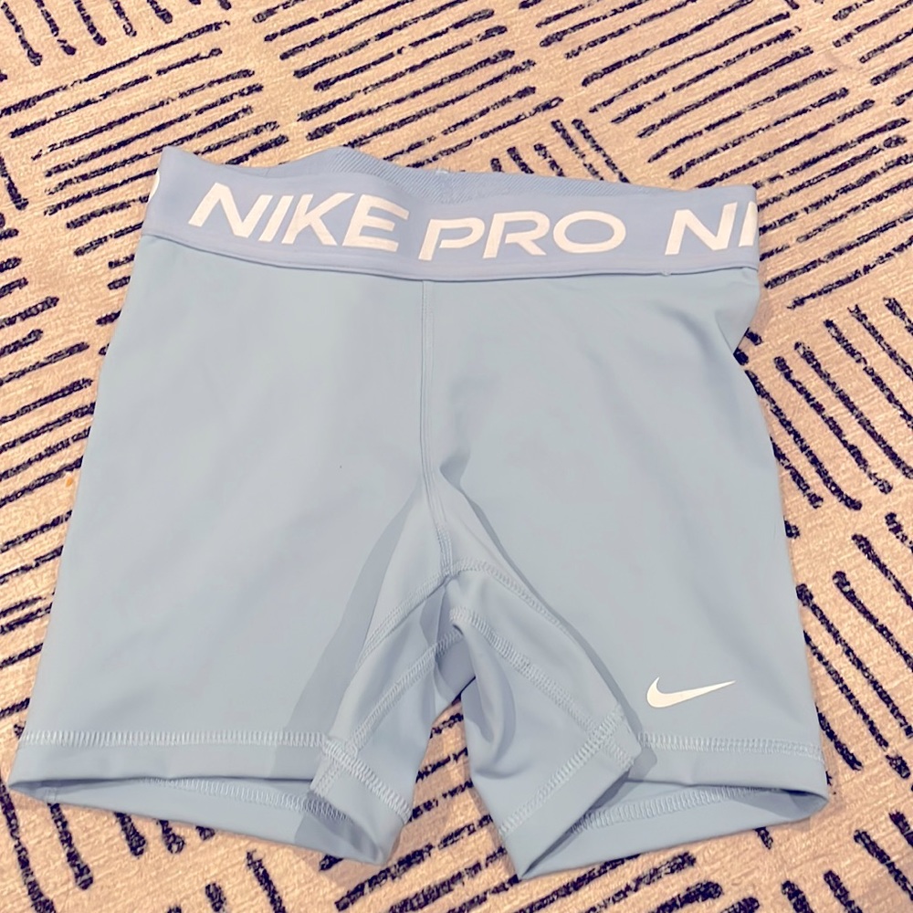 blue nike pro athletic shorts. size small. Worn once. Great condition.